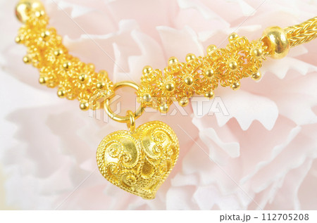 The Gold Bracelet on beautiful pink flower. 112705208