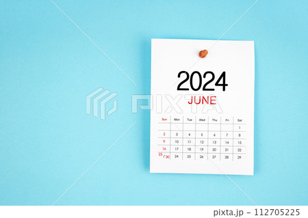 June 2024 calendar page with push pin on blue background. June 2024 calendar page with push pin on blue background. 112705225
