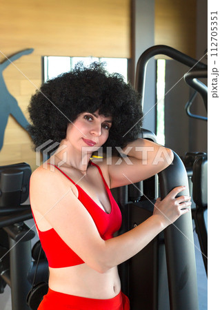 Athletic woman posing in the gym Athletic woman posing in the gym 112705351