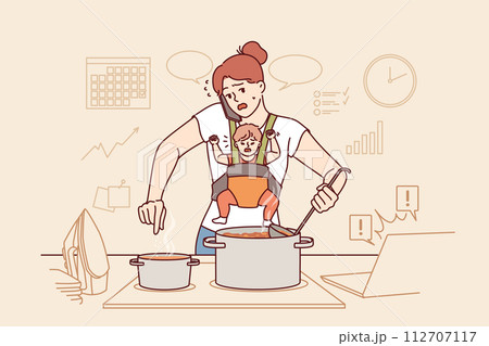 Mother takes care of baby and works around house at same time, stands with phone near kitchen stove 112707117