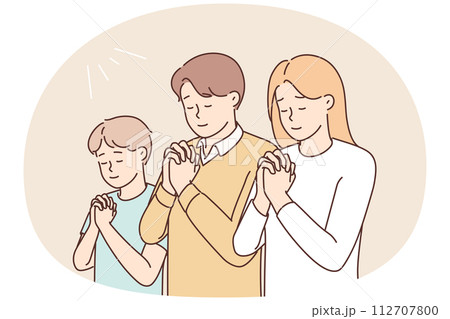 Religious family with child praying 112707800