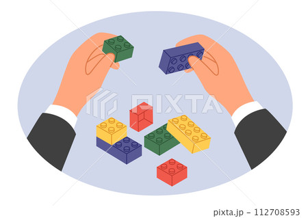 Hands businessman with toy bricks as metaphor for reorganization and restructuring company Hands businessman with toy bricks as metaphor for reorganization and restructuring company 112708593