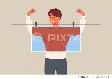 Man bodybuilder dreams of pumped up muscles and ripped abs, hiding behind photo with fake body 112708654