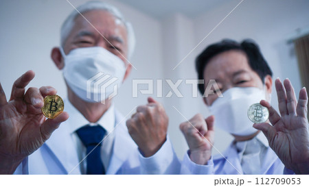 Crypto bitcoin digital currency in research and science technology investment concept Asian scientist Crypto bitcoin digital currency in research and science technology investment concept Asian scientist 112709053
