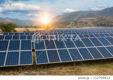 Solar power station. Solar panels, photovoltaics, alternative source of electricity - concept of sustainable and renewable sources. 112709412