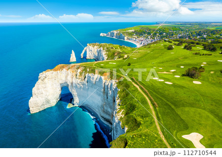 Picturesque panoramic landscape on the cliffs of Etretat. Natural amazing cliffs. Etretat, Normandy, France Picturesque panoramic landscape on the cliffs of Etretat. Natural amazing cliffs. Etretat, Normandy, France 112710544