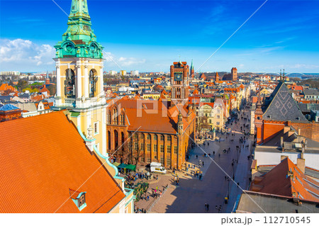 Aerial panoramic view of historical buildings and roofs in Polish medieval town Torun 112710545