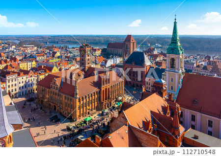 Aerial panoramic view of historical buildings and roofs in Polish medieval town Torun 112710548