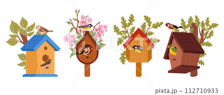 Wooden bird houses. Handcrafted spring bird house on tree, cartoon birds nests with feeders flat vector illustration set. Cute nesting bird house on white Wooden bird houses. Handcrafted spring bird house on tree, cartoon birds nests with feeders flat vector illustration set. Cute nesting bird house on white 112710933