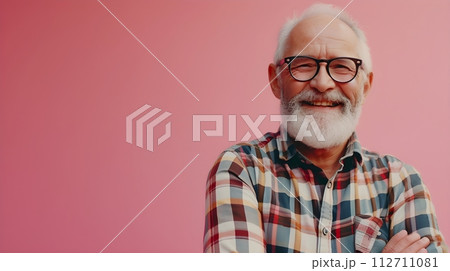 stylish Senior man smiling positive emotions on pink background with place for text 112711081