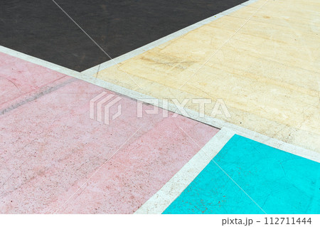 A colorful mosaic of a basketball court with a blue and green tile. The court is made up of different colored squares, with a pink square in the middle 112711444