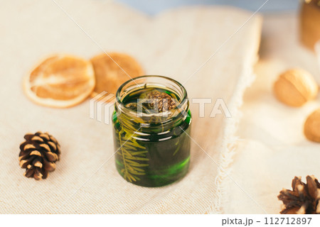 Jar with honey tincture of forest pine needles. Means and medicines of folk medicine 112712897