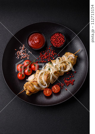 Delicious fresh chicken meat kebab with salt, spices and herbs 112713154