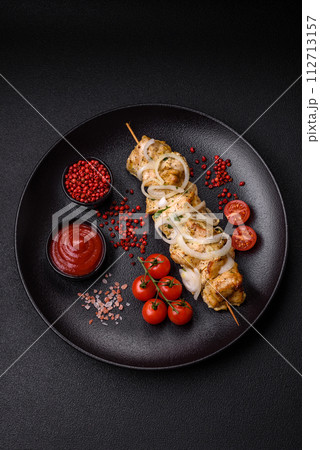 Delicious fresh chicken meat kebab with salt, spices and herbs 112713157
