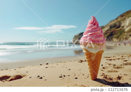 Ice cream in a waffle cone on a sandy beach with a blue sky background 112713876