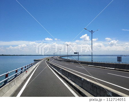 Riding along the part of the toll road designated for motorcycles across the water 112714051