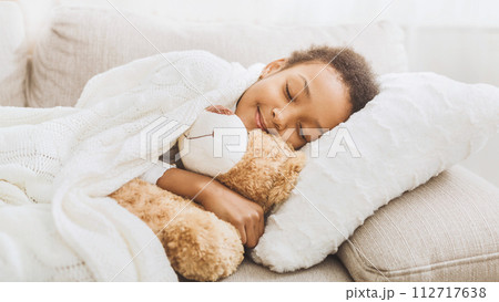 Adorable little girl sleeping in bed with her toy Adorable little girl sleeping in bed with her toy 112717638