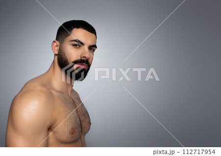 Portrait of attractive muscular middle eastern man with naked torso Portrait of attractive muscular middle eastern man with naked torso 112717954