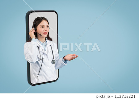 Female doctor in headset on phone screen consult, free space 112718221