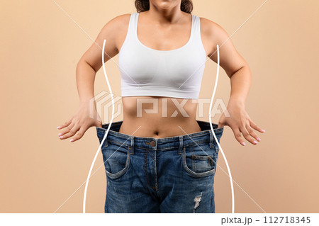 Weight Loss. Young Slim Female Pulling Big Jeans With Drawn Silhouette Outlines Weight Loss. Young Slim Female Pulling Big Jeans With Drawn Silhouette Outlines 112718345