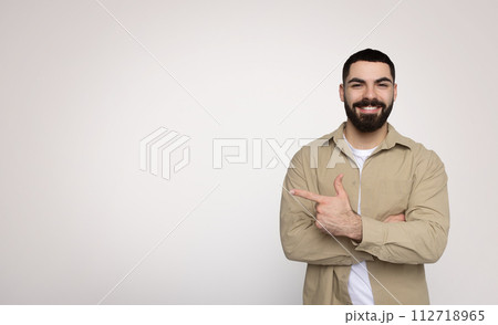 Happy and confident bearded man giving a thumbs-up gesture, casually Happy and confident bearded man giving a thumbs-up gesture, casually 112718965