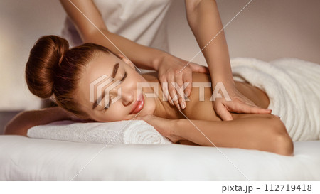 Body Care. Woman Enjoying Shoulder Massage With Closed Eyes Body Care. Woman Enjoying Shoulder Massage With Closed Eyes 112719418