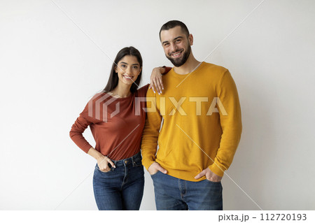 Portrait Of Happy Young Man And Woman Posing Over White Wall Background 112720193