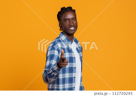 Handsome Young African American Guy Pointing At Camera With Hand, Saying Gotcha Handsome Young African American Guy Pointing At Camera With Hand, Saying Gotcha 112720293