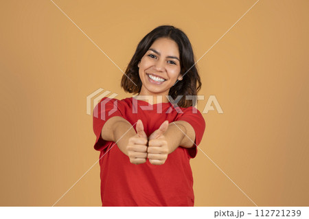 Happy middle eastern lady showing thumb ups Happy middle eastern lady showing thumb ups 112721239