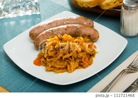 Sausages with stewed cabbage Sausages with stewed cabbage 112721468
