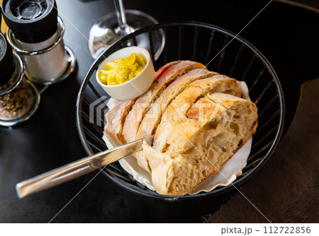 Slices of home baked white bread and fresh butter 112722856
