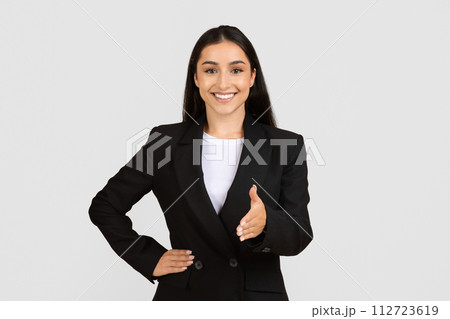 Professional woman with handshake gesture Professional woman with handshake gesture 112723619