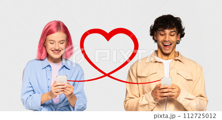 A girl with pink hair and braces joyfully looks at her phone, while a man in a beige jacket laughs at his A girl with pink hair and braces joyfully looks at her phone, while a man in a beige jacket laughs at his 112725012