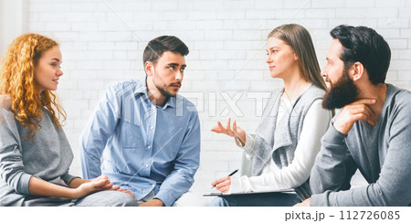 Mentor Psychologist Talking To Group Members At Therapy Session Mentor Psychologist Talking To Group Members At Therapy Session 112726085