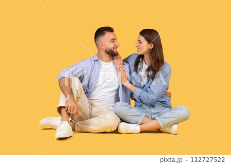 Casual couple sitting and enjoying loving moment together Casual couple sitting and enjoying loving moment together 112727522