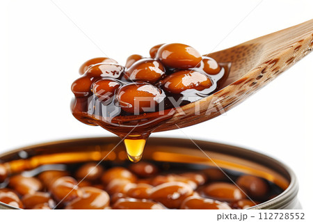 Baked beans in a wooden spoon isolated on background, transparency Baked beans in a wooden spoon isolated on background, transparency 112728552
