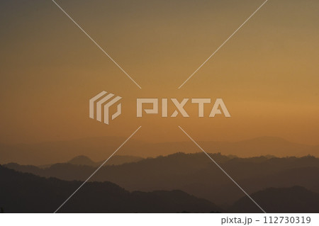 landscape and travel concept with sunset and twilight sky with layer of mountain 112730319