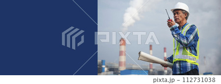 Banner Senior Electrician engineer man hand holding red Walkie talkie wear White hardhat at Power plant electrical stations. Panorama Technician blue hard hat helmet Engineer industry with copy space Banner Senior Electrician engineer man hand holding red Walkie talkie wear White hardhat at Power plant electrical stations. Panorama Technician blue hard hat helmet Engineer industry with copy space 112731038