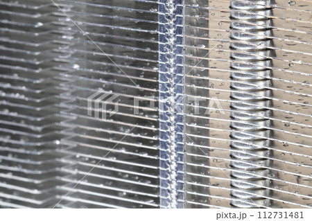 Close up view of passive heatsink with the aluminum fin and copper heat pipe structure isolate on white background. Close up view of passive heatsink with the aluminum fin and copper heat pipe structure isolate on white background. 112731481