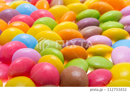 chocolate colored buttons isolated 112733832