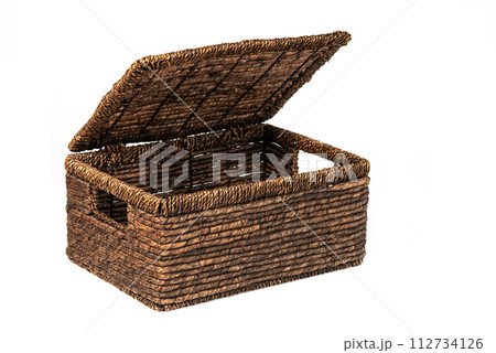 Open wicker box. Empty laundry basket. Object isolated on white background Open wicker box. Empty laundry basket. Object isolated on white background 112734126