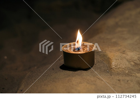 trench military candle isolated on white background. made by Ukrainian volunteers for soldiers serving on the front line. trench military candle isolated on white background. made by Ukrainian volunteers for soldiers serving on the front line. 112734245