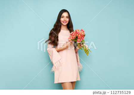 Happy beauty woman with pink tulip bouquet Happy beauty woman with pink tulip bouquet 112735129