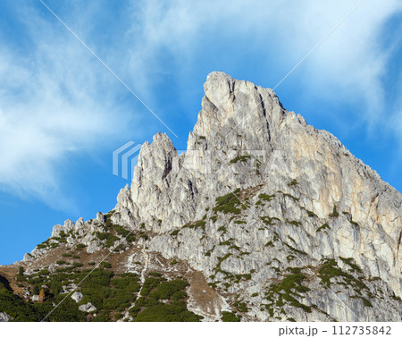Sunny colorful autumn alpine Dolomites mountain scene, Falzarego Pass, Sudtirol, Italy. Sunny colorful autumn alpine Dolomites mountain scene, Falzarego Pass, Sudtirol, Italy. 112735842