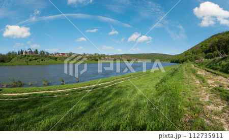 Amazing spring view on the Dnister River Canyon. View from Nezvysko village blossoming river coast,.Ivano-Frankivsk region, Ukraine Amazing spring view on the Dnister River Canyon. View from Nezvysko village blossoming river coast,.Ivano-Frankivsk region, Ukraine 112735911