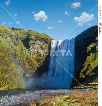 Picturesque full of water big waterfall Skogafoss autumn view, southwest Iceland. 112736419