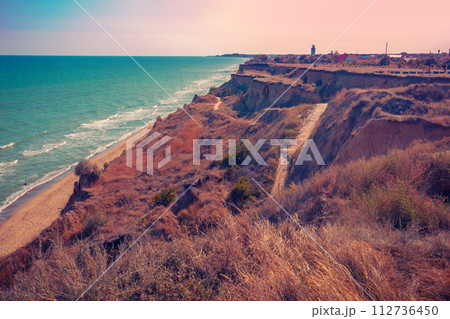 Seascape with the sea and a steep clay coast. Ukraine Seascape with the sea and a steep clay coast. Ukraine 112736450