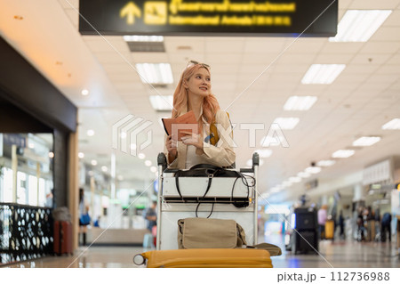 Airport travel and woman with passport, flight ticket or information of immigration, journey and luggage. identity document and international registration 112736988
