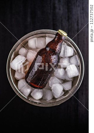 Bucket Filled With Ice and one Bottles of Beer Bucket Filled With Ice and one Bottles of Beer 112737502