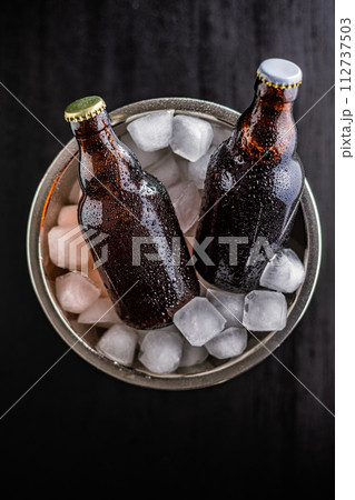 Bucket Filled With Ice and Two Bottles of Beer 112737503